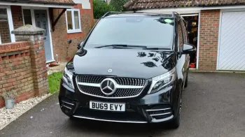 Black Mercedes V-Class parked on a driveway