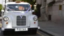 Front view of Classic Taxi Cab with White Ribbons