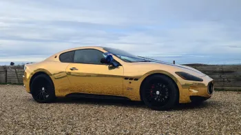 Right side view of Gold Maserati