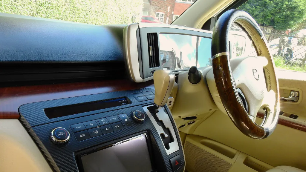 Front Driver seat with wooden steering wheel