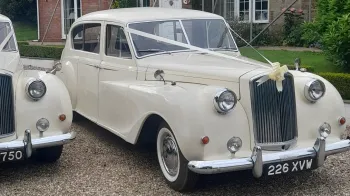 Classic Austin Princess Limousine decorated with ivory ribbons