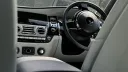 Front view of dashboard and steering wheel inside Rolls-Royce Ghost