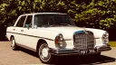 Front right side view of Classic Mercedes 280 with large chrome grill