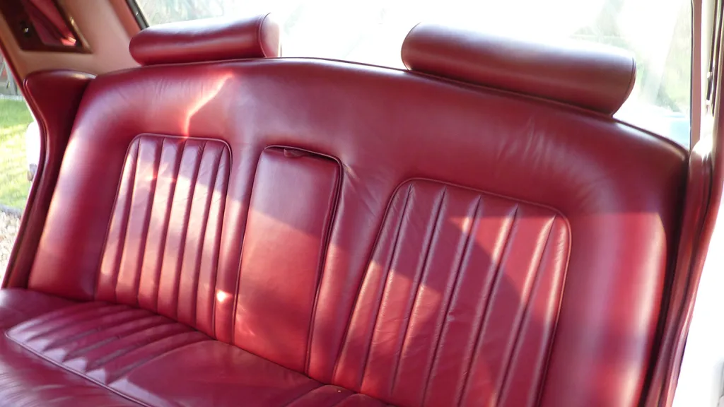 Rear interior Burgundy Leather seat inside a 1974 Classic Rolls-Royce Silver Shadow