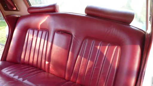 Rear interior Burgundy Leather seat inside a 1974 Classic Rolls-Royce Silver Shadow