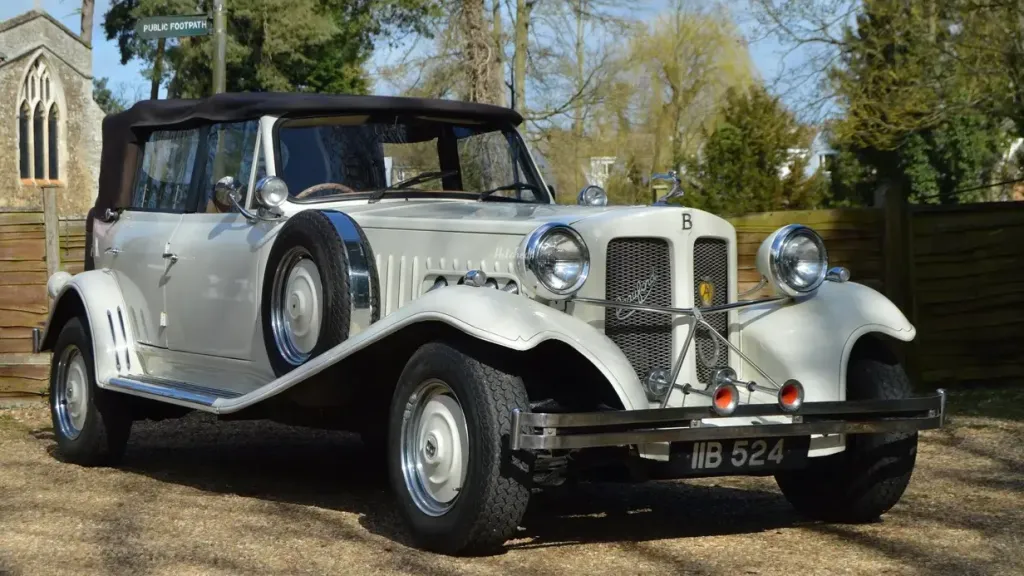 Right front view of vintage style Beauford Convertible in Ivory with black soft-top roof