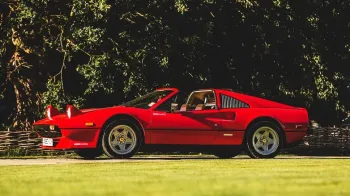 Left side view of Red Ferrari with Roof open
