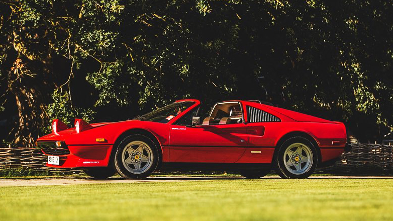 Left side view of Red Ferrari with Roof open