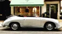 Right side view of classic Porsche 356 with convertible soft top roof down