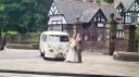 Bride and Groom standing in front of a classic VW campervan