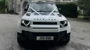 Full Front View of white land rover defender