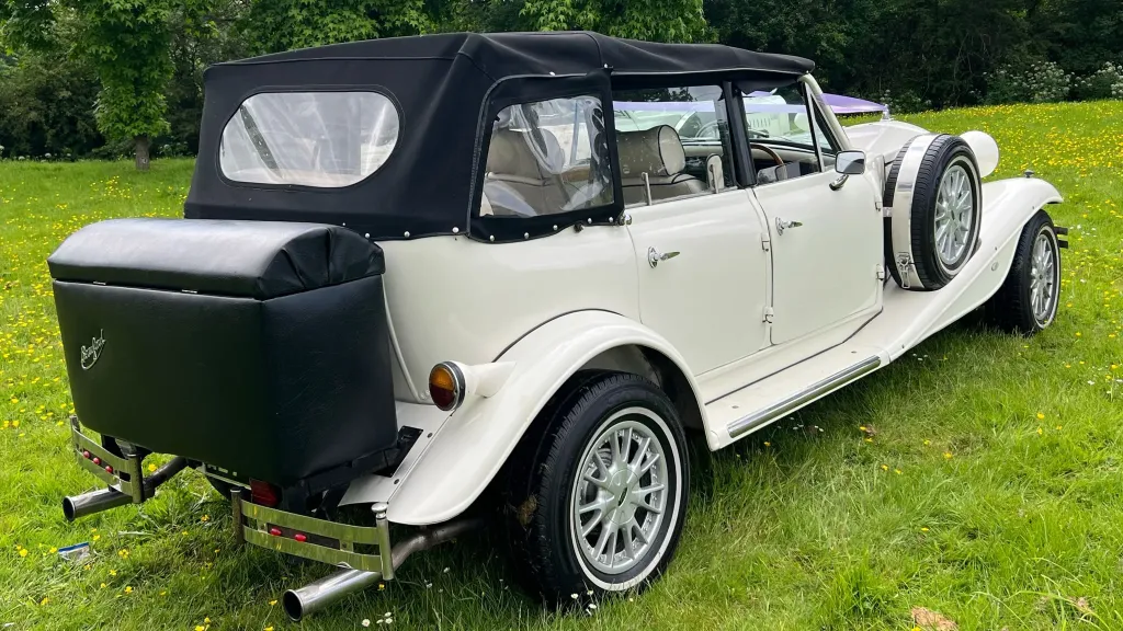 Rear view of Beauford with black soft top roof and black rear picnic trunk