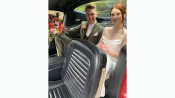 Bride and groom seating inside a classic ford Mustang Fastback, Black Leather Interior