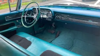 Front bench seat inside Classic American Cadillac.