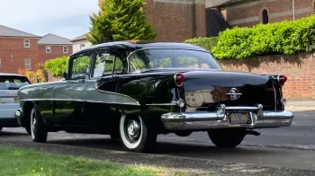 left rear side view of classic American Oldsmobile
