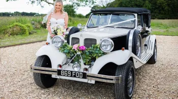 Black & White Vintage Beauford with Bride in the background