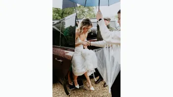 Bride exiting the rear of a Modern Landrover Defender