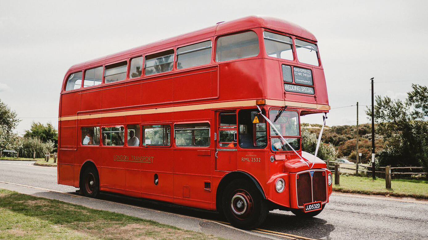Old Vintage double decker London Routemaster bus decorated with white ribbons