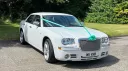 White Chrysler 300c Saloon Car with matching Aqua Green Ribbons and bows