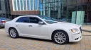 Right side view of a white Chrysler modenr car