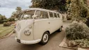 Front left view of classic campervan in two tone white and sage green