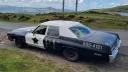 Aerial rear view of the Bluesmobile sheriff car in Black and White