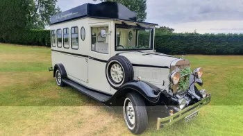 Black & Ivory Asquith Vintage Style Bus with spare wheel mounted on the side, large passengers windows at the rear