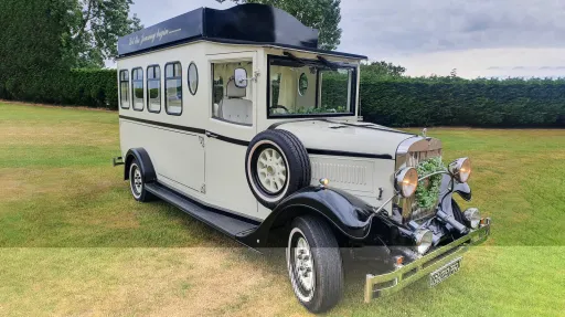Black & Ivory Asquith Vintage Style Bus with spare wheel mounted on the side, large passengers windows at the rear