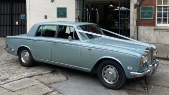 Rolls-Royce Silver Shadow dressed with white ribbons parked in the street of Bristol
