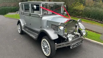 Vintage Imperial in silver with red wedding ribbons and white wall tires