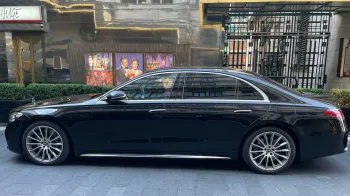 Left side view of Black Mercedes parked in street of London