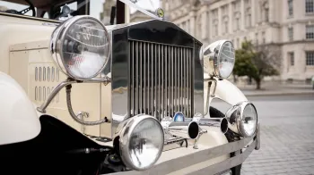 Close-up front chrome grill with chrome headlights on Imperial car