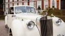 Close-up view of front grill and headlights on a cream vintage royale windsor