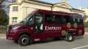 Left side view of Burgundy coach