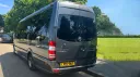 Rear view of Grey Mercedes Sprinter Mini Bus with privacy windows