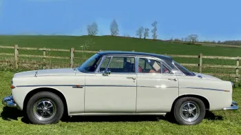 Left side view of a classic Rover P5 Coupe in cream with black roof