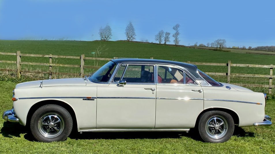 Left side view of a classic Rover P5 Coupe in cream with black roof