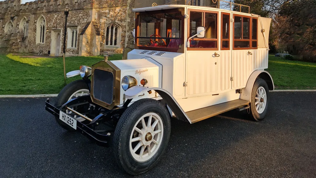 Edwardian Style Fleur De Flys Car with White Wheels, Wooden windows frames and Gold Coloured front grill