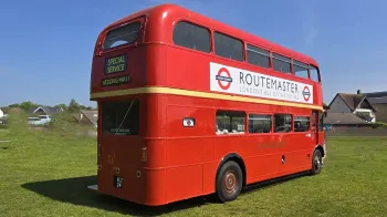 Routemaster London Bus right side from the rear showing Routemaster advert onthe side of the bus