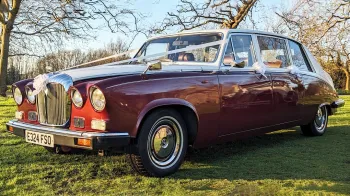 left side view of Classic Daimler Limousine in two-tone Burgundy and White