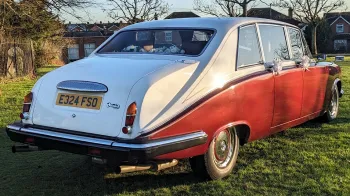 Rear view of Bugundy Daimler Limousine with White Roof