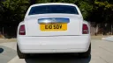 Rear view of White Rolls-Royce phantom with privacy rear window