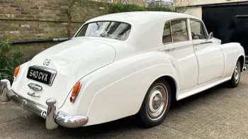 Rear view of Classic Rolls-Royce silver Cloud in White