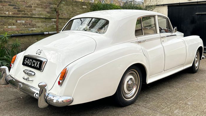 Rear view of Classic Rolls-Royce silver Cloud in White
