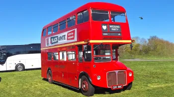 Right side view of Classic Double Decker Routemaster Bus with original advertising on side