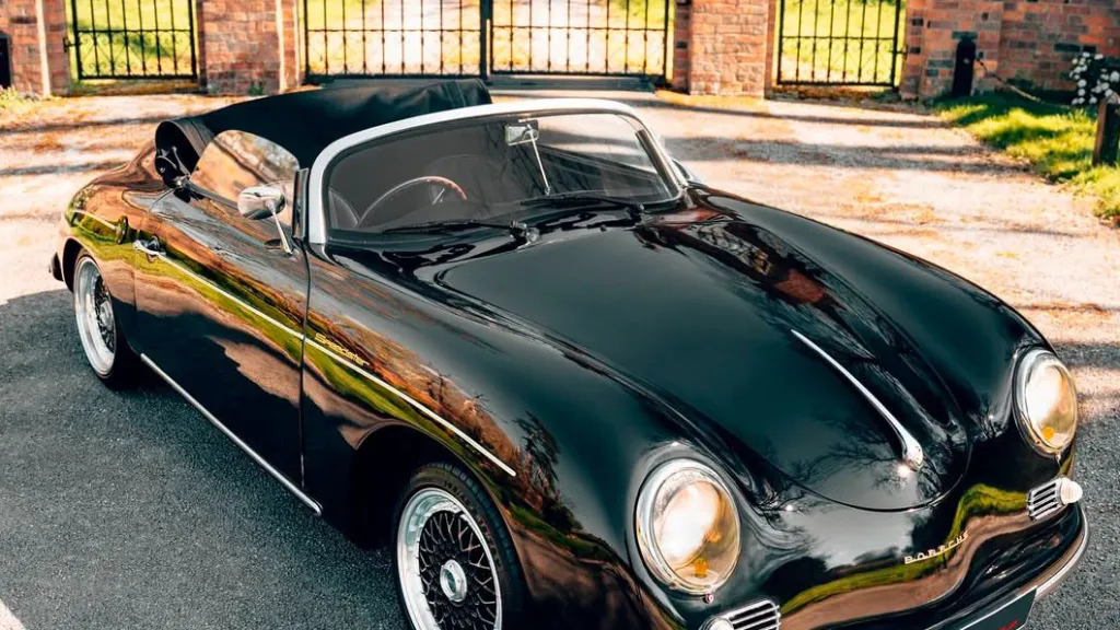 Black Porsche with convertible roof open