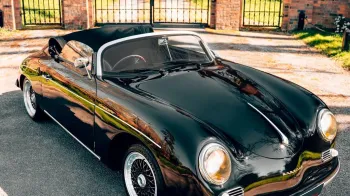 Black Porsche with convertible roof open