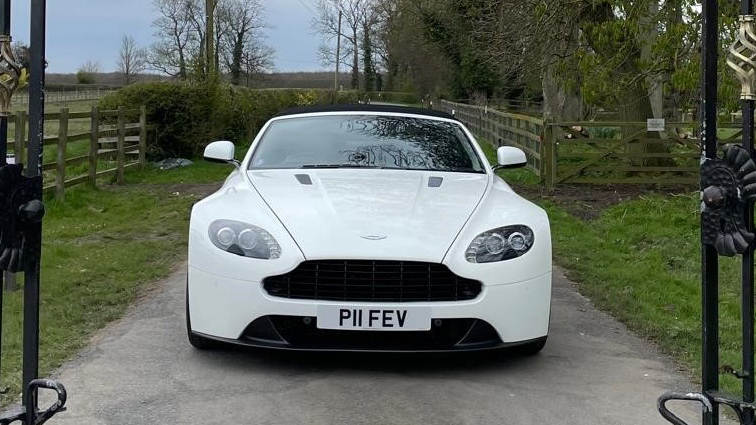 Full front view of modern White Aston Martin