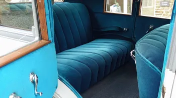 Rear interior blue velour seats inside a Vintage American Buick