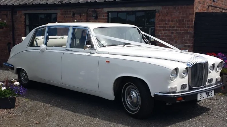 Front right view of Classic Daimler Limousine in Old English white with white ribbons